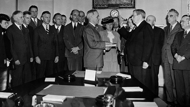 Chief Justice Harlan F. Stone administers the oath of office to Harry S. Truman in the Cabinet Room of the White House on April 12, 1945, after death of President Franklin D. Roosevelt.