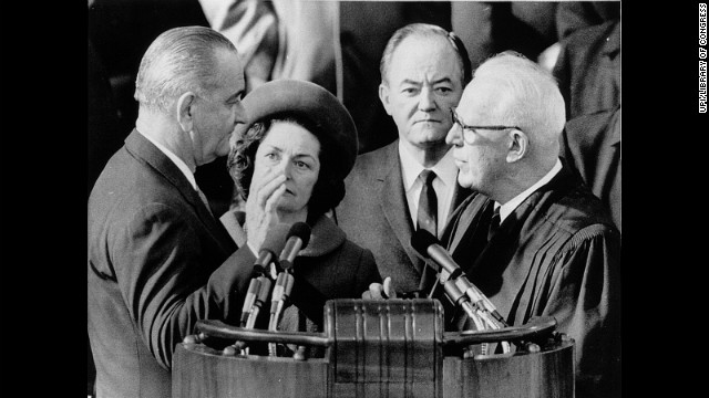 Lyndon B. Johnson, left, is sworn in for his second term by Chief Justice Earl Warren on January 20, 1965.