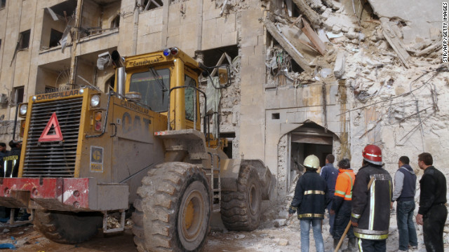 Emergency personnel inspect the scene of an explosion in Aleppo, Syria, on January 18.