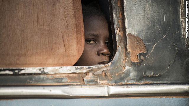 A Malian child looks out from a bus as Malian army soldiers check vehicles and passengers in the city of Niono on Friday, January 18. Malian troops, with help from France and a U.N.-mandated African force, are fighting al Qaeda-linked Islamist militants.