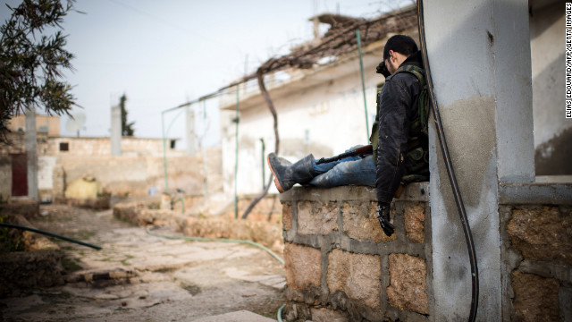 An anti-regime fighter rests in a rebel controlled area of Aleppo on January 18.