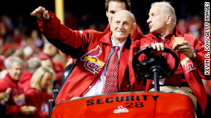 Stan Musial waves to fans during the 2012 National League Championship Series.