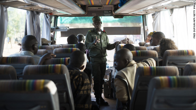 Malian soldiers check the identity of passengers in a bus coming from Mopti on January 19.