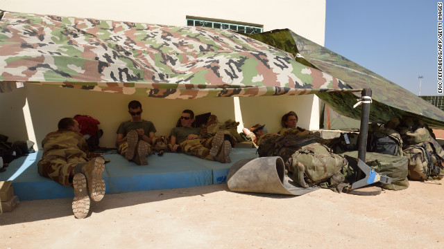 French soldiers of the 5th Combat Helicopter Regiment relax on January 19 at the airbase near Bamako.