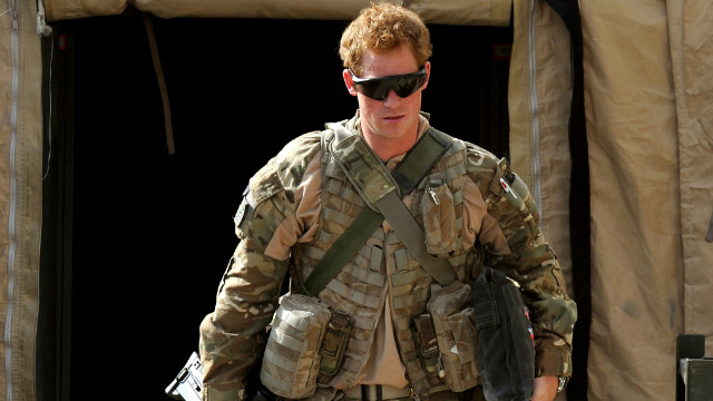 Prince Harry walks around a military base in Helmand province on his recent tour of duty in Afghanistan. His deployment meant he could step back from the public eye and live in contrast to his privileged upbringing.