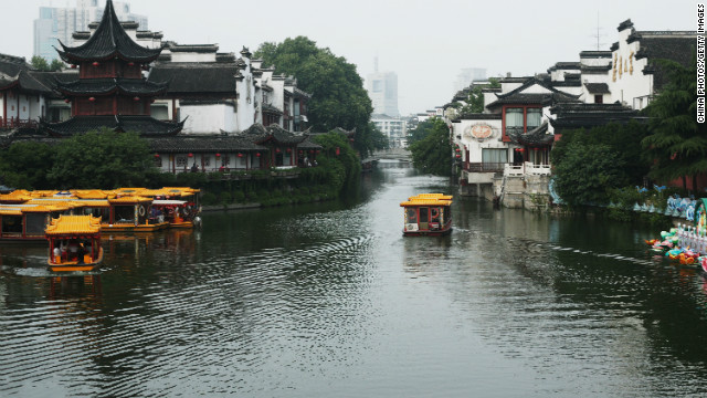 Sightseeing boats on the Qinhuai River pass close to Nanjing's Confucius Temple -- an example of the city's diverse architecture.