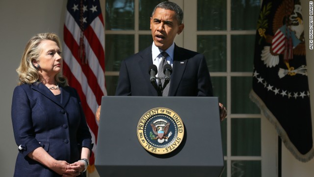 Clinton looks on as President Barack Obama makes a statement in response to the attack at the U.S. Consulate in Libya on September 12, 2012 at the Rose Garden of the White House.