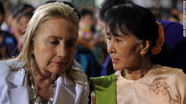 Clinton chats with Myanmar opposition leader Aung San Suu Kyi before President Barack Obama speaks at the University of Yangon in Yangon on November 19, 2012.