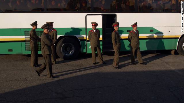 Soldiers board a bus outside a theater in Pyongyang in April 2012.