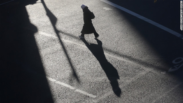 A lone pedestrian braves the winter chill on a Manhattan street on Thursday, January 24.