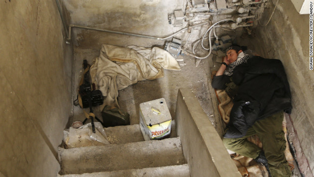 A Free Syrian Army rebel takes a break in Damascus on January 25.