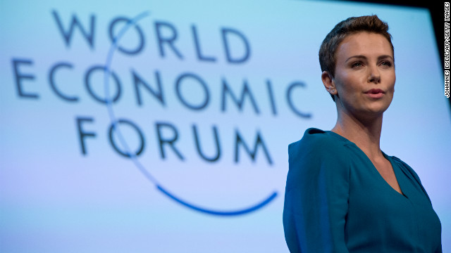 Theron gives a speech after picking up the 2013 World Economic Forum Crystal Award for her humanitarian work. 