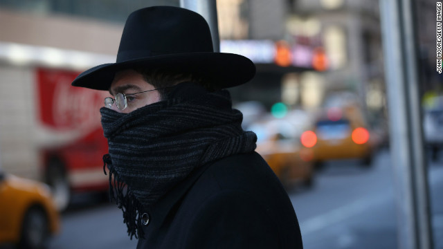 A pedestrian bundled up against the cold walks through the streets of Manhattan on Friday, January 24, in New York City. Polar air settled in over the northeastern U.S. Wednesday, with temperatures in the teens and 20s. Forecasters warned that "bitterly cold conditions" were expected across much of the Northeast, Mid-Atlantic and Mideast through this weekend.