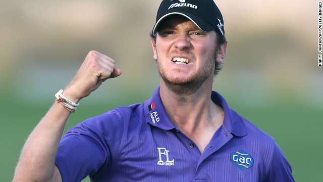 Chris Wood celebrates after holing an eagle putt on the final hole to win the Qatar Masters in Doha on Saturday.