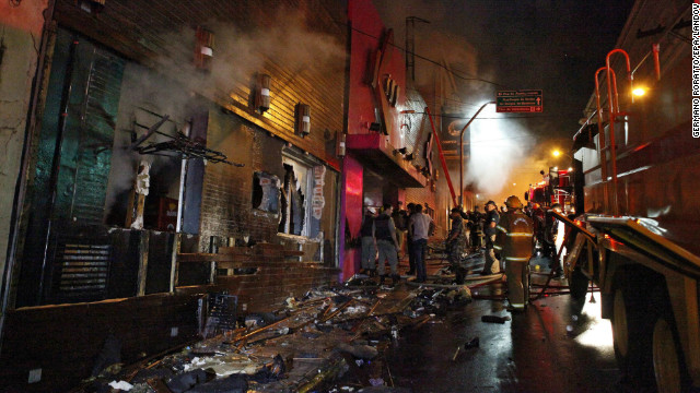 Emergency personnel gather outside the burned-out Kiss nightclub in Santa Maria, Brazil. The nightclub is popular with young people, drawing between 2,000 and 3,000 people a night on the weekends.