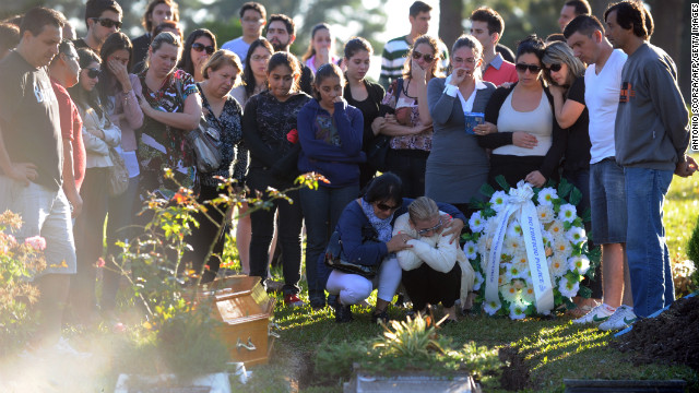 Relatives and friends of one of the victims of the Kiss nightclub fire gather during the funeral at Santa Rita Cemetery in Santa Maria, Brazil, on Monday, January 28. More than 230 people died and more than 120 were injured early Sunday when a fire tore through the nightclub packed with university students in southern Brazil, police said.