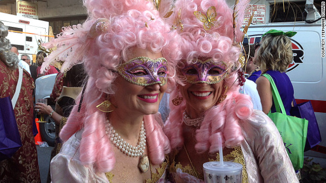 Two ladies from the Krewe of Cork display their Carnival attire during an afternoon parade through the French Quarter.