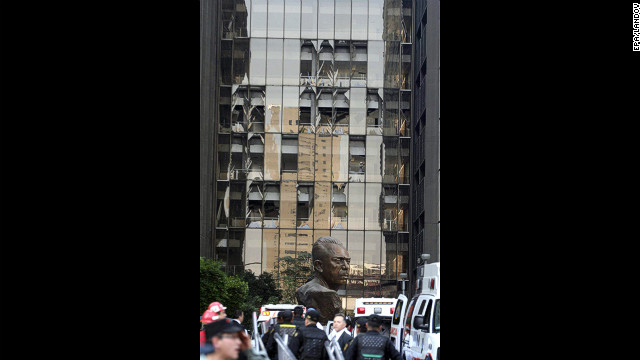 Damaged windows from the blast rise several stories high.