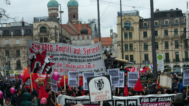 People protest with banners and signs during a rally against the 49th Munich Security Conference on February 2, 2013.