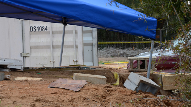 A tent covers the bunker where the standoff took place. An FBI team rescued the child and killed Dykes during the operation on February 4.