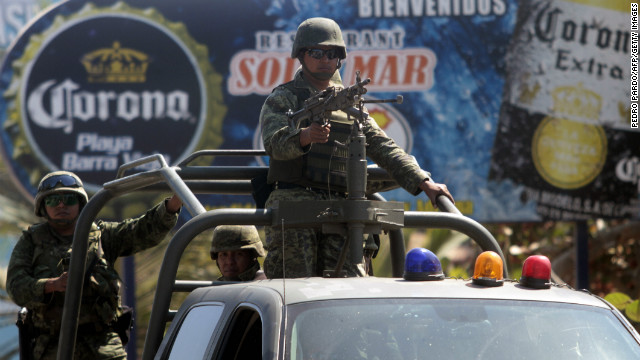 Soldiers stand guard near the house where six Spanish women tourists were raped in Acapulco, Mexico on February 5, 2013. 