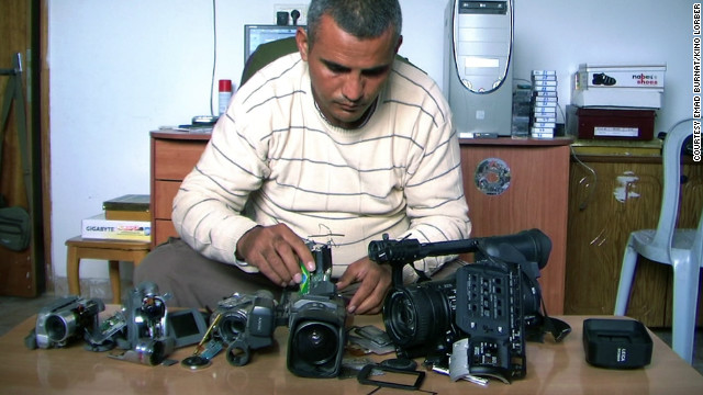 Co-director Emad Burnat with his five broken cameras