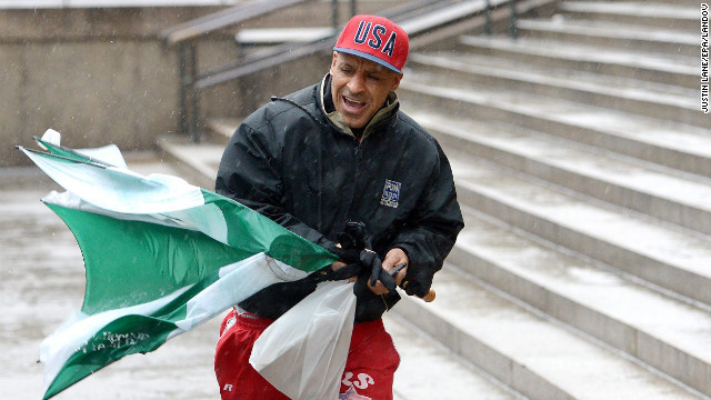 Ricky Varona copes with the wind and precipitation February 8 in New York.