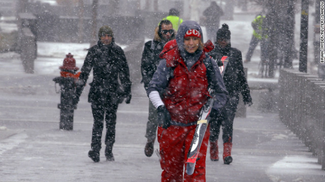 Skiing seems like a good idea as snow begins to fall in Boston on February 8.