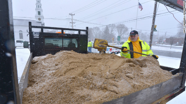 Jerry Trebino loads sand onto the back of a snowplow February 8 in Wrentham, Massachusetts. The storm is expected to spawn travel headaches for a large swath of the region.