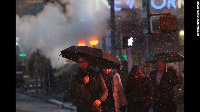 Pedestrians battle wind, snow and sleet in Manhattan on Friday.