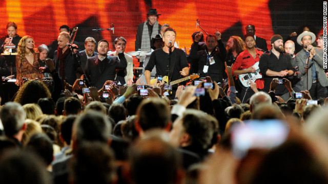 Left to right: Musicians Faith Hill, Garry Tallent, Sting, Ted Dwane, Ken Casey, Ben Lovett, Springsteen, Jim James, Tom Morello, Zac Brown and Ben Harper perform onstage.