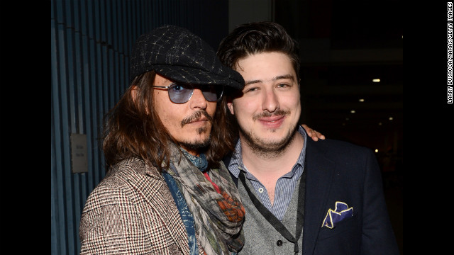 Actor Johnny Depp and Marcus Mumford of Mumford &amp; Sons attend the Musicares gala.