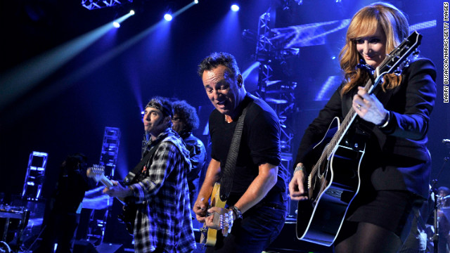 Springsteen and Patti Scialfa perform onstage.