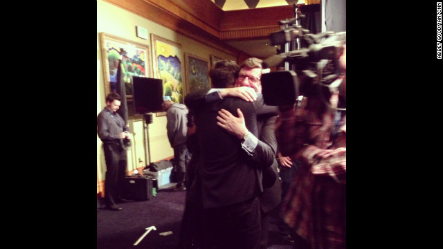 Marcus Mumford and his proud father, John, share a heart-meltingly sweet bear hug backstage after Mumford &amp; Sons' "Babel" won album of the year. 