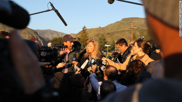 Cindy Bachman, information officers for the San Bernardino County Sheriff's Department, speaks to reporters at a roadblock near Big Bear Lake, California, on Tuesday, February 12. Christopher Jordan Dorner has been the subject of a massive manhunt and is accused of killing one police officer and wounding two others, as well as killing the daughter of his police union representative and her fiance on Sunday.