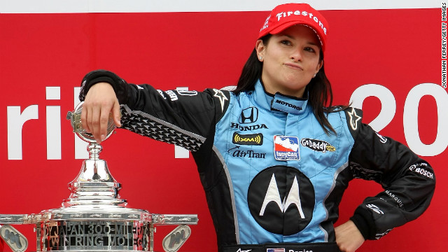 Patrick poses with the trophy after winning the Bridgestone Indy Japan 300 Mile in 2008 in Motegi, Japan.