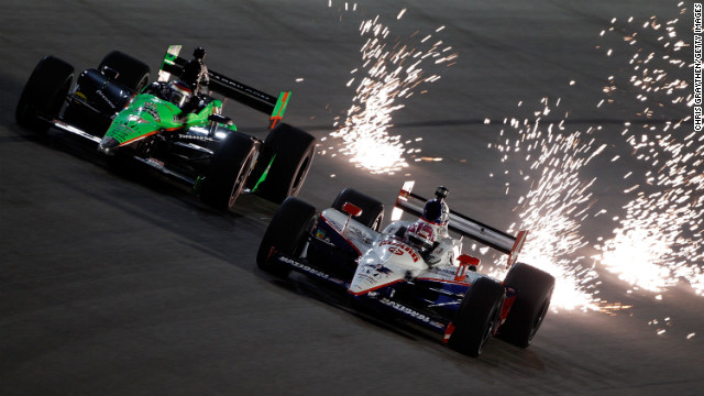 Patrick, left, drives next to Dan Wheldon during practice for the Cafes do Brasil Indy 300 in 2010 in Homestead, Florida. (Wheldon died in 2011 at the Las Vegas Indy 300).