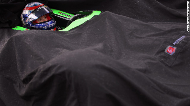 Patrick waits in the rain while her car is covered during qualifying for the Indianapolis 500 in 2011.