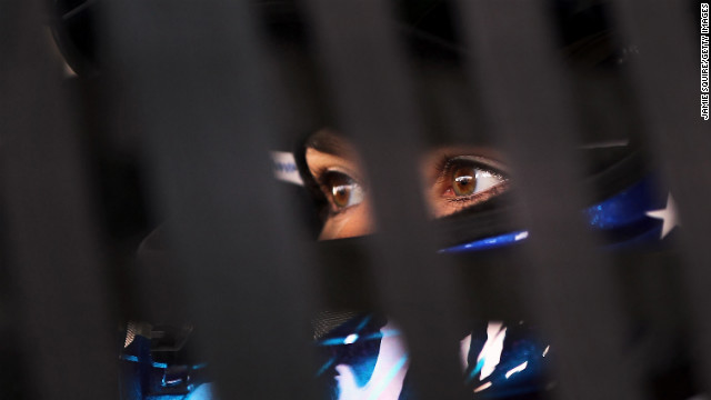 Patrick sits in her car in the garage area during practice for the VFW Sport Clips Help a Hero 200 in 2012 in Darlington, South Carolina.