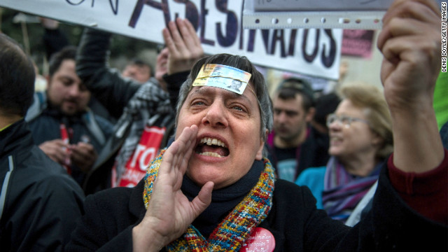 People protest against the Spanish laws on house evictions outside the Spanish parliament on February 12 in Madrid, Spain.