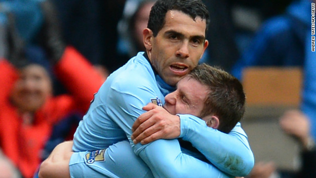 Carlos Tevez is hugged by James Milner after the Argentina star scored Manchester City's second goal against Chelsea in the 2-0 win.