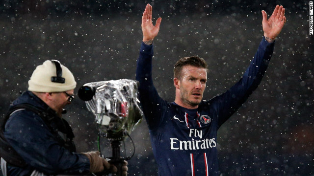 David Beckham acknowledges the crowd after making a winning debut for PSG against Marseille.