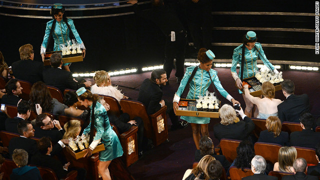 Hostesses hand out snacks during a break in the Oscars.