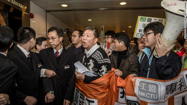 Activists demonstrate against the bid to punish striking drivers at the Singaporean consulate in Hong Kong on December 5, 2012.