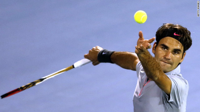 Switzerland's Roger Federer serves against Malek Jaziri as he eyes his sixth Dubai Tennis Championships title