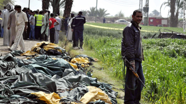 Egyptians inspect the site where a hot air balloon exploded over the city of Luxor on Tuesday, February 26. Eighteen tourists were killed when the balloon dropped almost 1,000 feet (about 300 meters), authorities said. Three people were injured.