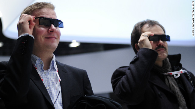 Two men test a new Samsung 3D device during the first day of the Mobile World Congress.