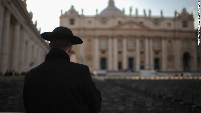  A priest stands next to St Peter's Basilica on February 26, 2013 in Rome, Italy.