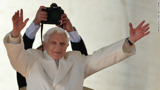 Pope Benedict XVI waves from the altar as he arrives on St Peter's square for his last weekly audience on February 27, 2013 at the Vatican.