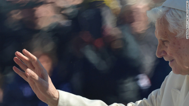 The pope waves to the crowd.